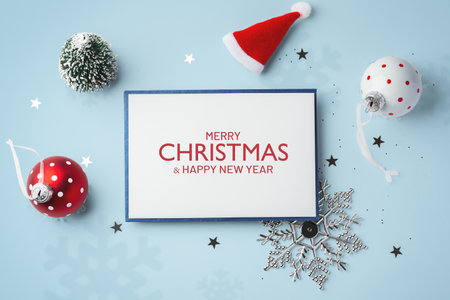 Merry Christmas and happy new year card with christmas decoration on blue background, top viewの写真素材