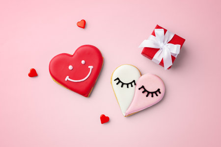 Love heart cookies with gift box, valentines day on pink background, top viewの写真素材