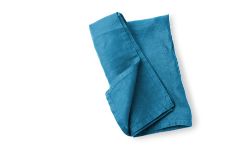 Blue linen napkin cloth folded isolated on white background, copy spaceの写真素材