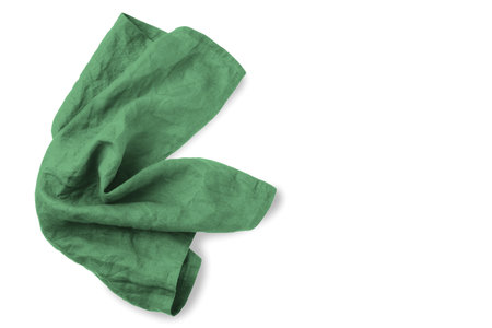 Green linen tablecloth isolated on white background, top view, copy spaceの写真素材