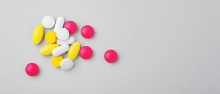 Medical pills, tablet, assorted drugs on grey background, top view, copy spaceの写真素材