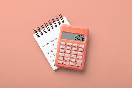 Calculator on calendar on gray background, 2026 new year financial resolutions, budget planning, top viewの写真素材