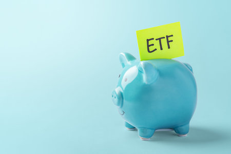 ETF concept with blue piggy bank on blue background, copy space