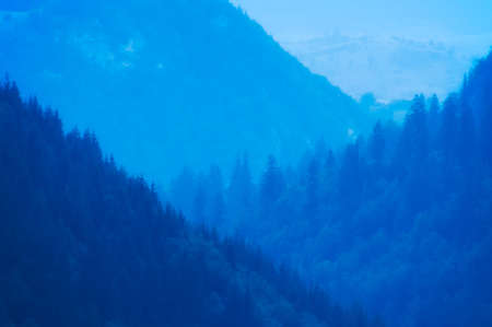 Diagonal moutain sides (foggy, late evening)の写真素材