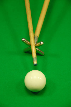 Player striking the cue ball with a rest (view from above)の写真素材
