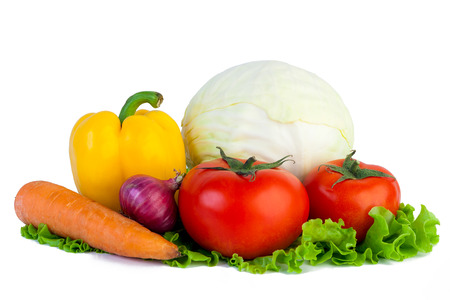 Vegetables on isolated white background. Cabbage, tomato, onion, pepper, carrotの写真素材