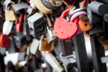 The city bridge with a lot of metal locks. Romantic traditionsの写真素材