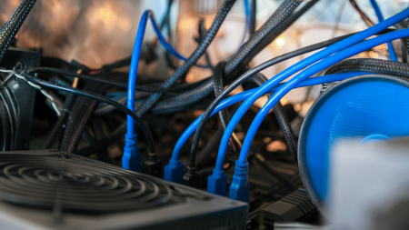 Close-up equipment for mining crypto-bitcoin, ether. Video cards, motherboards, blue lightsの写真素材