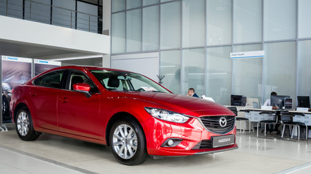 Novosibirsk, Russia - May 18, 2017: red Mazda 6, side view. Photography of a classic sedan in the showroomのeditorial素材