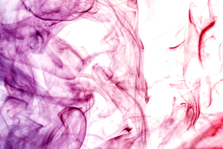 Colorful smoke of  pink, purple on a white isolated background. Background from the smoke of vapeの写真素材