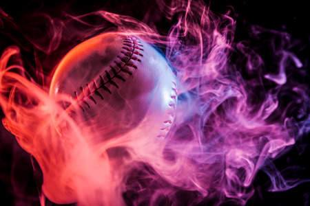 White baseball ball in multi-colored red smoke from a vape on a black isolated backgroundの写真素材
