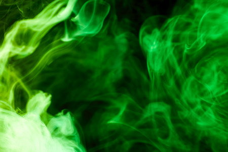 Green  smoke on black backgroundの写真素材