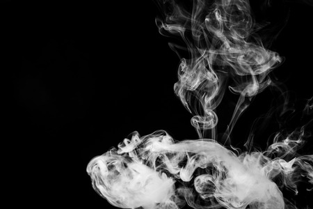 White  smoke on black backgroundの写真素材
