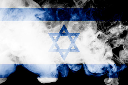 National flag of Israel from thick colored smoke on a black isolated backgroundの写真素材