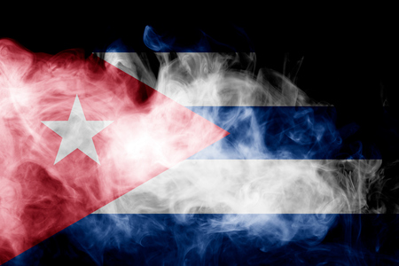 National flag of Cuba from thick colored smoke on a black isolated backgroundの写真素材