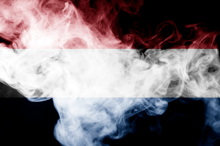 National flag of Netherlands from thick colored smoke on a black isolated backgroundの写真素材