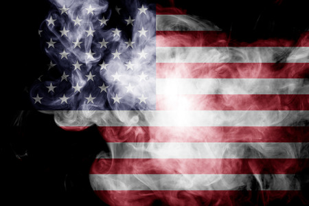 National flag of USA from thick colored smoke on a black isolated backgroundの写真素材