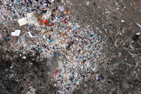 Helicopter drone shot. Aerial photography is a modern urban dump. Landfill with a lot of debris...