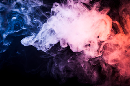 Pink, blue  cloud smoke on black  isolated background
の写真素材