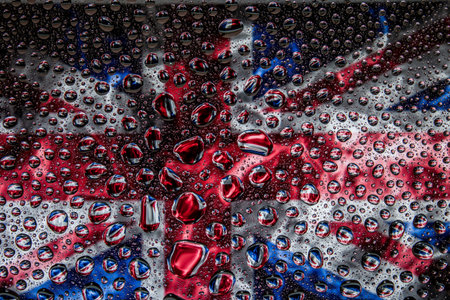 Close-up of a drop of water against a background of the national flag of  United Kindom on an isolated backgroundの写真素材