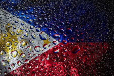 Close-up of a drop of water against a background of the national flag of   Philippines on an isolated backgroundの写真素材