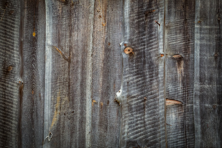 Close-up of an old coorail wooden fence, a texture of wooden boardsの写真素材