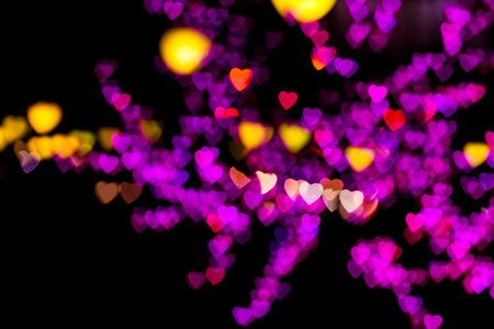 Blurring lights bokeh background of pink, red, orange, yellow, purple  hearts