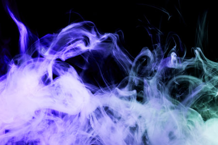 Colorful  blue smoke  on a black isolated background. Background from the smoke of vapeの写真素材