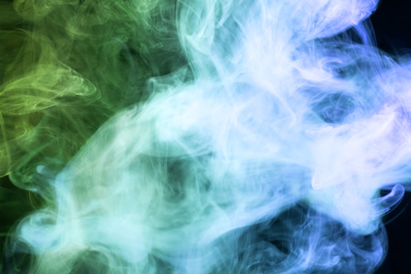 Blue and green  cloud smoke on black  isolated backgroundの写真素材