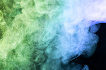 Blue and green  cloud smoke on black  isolated backgroundの写真素材