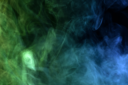 Blue and green  cloud smoke on black  isolated backgroundの写真素材