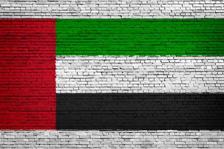 National flag of United Arab Emirates  on a brick backgroundの写真素材