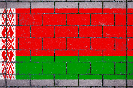 National flag of Belarus against a background of a stone background covered with mossの写真素材