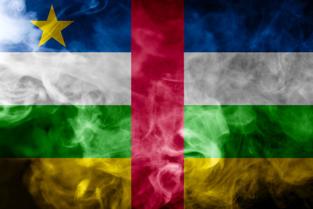 National flag of Central African Republic from thick colored smoke on a black isolated backgroundの写真素材