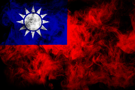 National flag of Taiwan from thick colored smoke on a black isolated backgroundの写真素材