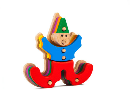 Photo of a wooden toy  children's clown sorter clown-shaped sorter from colorful pieces on a white isolated background. The toy for the development of fine motor childの写真素材