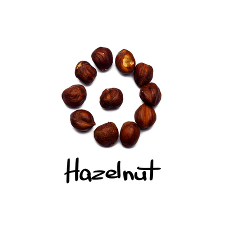 Walnut pattern - hazelnuts on a white background in the form of a circle. Concepts about decoration, healthy eating and food background.の写真素材