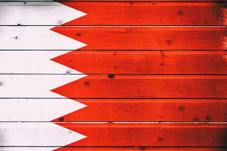 National flag of Bahrain  on a  wooden backgroundの写真素材