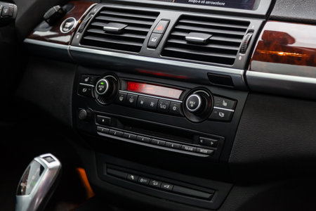 Novosibirsk, Russia - February 16, 2019:  BMW X5,close-up of the dashboard, adjustment of the blower, air conditioner, player. Photography of a modern car on a parking in Novosibirskのeditorial素材