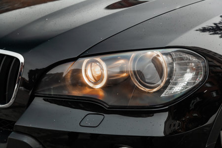 Novosibirsk, Russia - February 16, 2019:  BMW X5,close-up of the headlights. Photography of a modern car on a parking in Novosibirskのeditorial素材