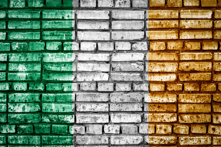 National flag of Ireland on a brick background. Concept image for Ireland: language , people and culture.の写真素材