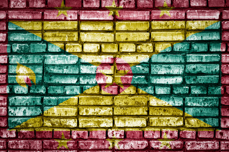 National flag of Grenada on a brick background. Concept image for Grenada: language , people and culture.の写真素材