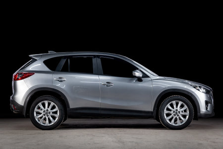 Novosibirsk, Russia - March 10, 2019:  Mazda CX-5, side view. Photography of a modern car  on a parking in Novosibirsk against a black wallのeditorial素材