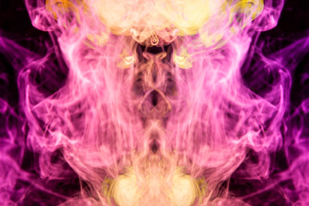 Cloud of yellow and pink smoke  in the form of a skull, monster, dragon  on a black isolated...