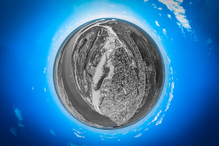 Helicopter drone shot. Aerial photography of a small village with villas and cottages, river, beach,forest and roads. Panoramic city 360  shot from aboveの写真素材