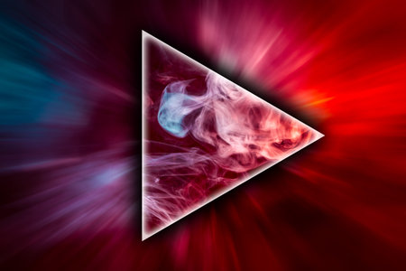 Close up swirling red and blue smoke in the shape of a triangle on black isolated background