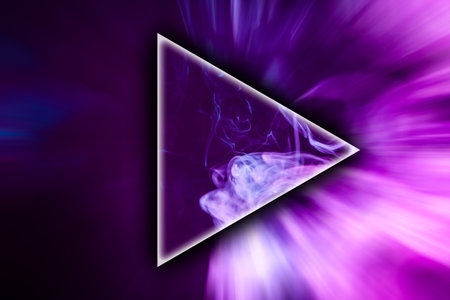Pink and blue cloud of smoke in the shape of a triangle on  black isolated background. Background...