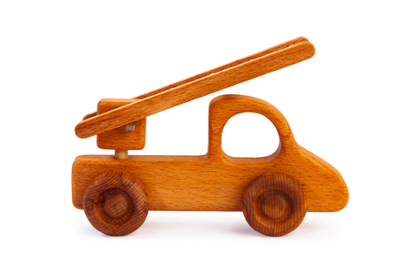 Photo of a wooden car truck made of beech on a white isolated backgroundの写真素材