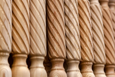 close-up wooden product from pine, baluster for the stairs, made by hand by an experienced joiner....