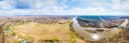 Aerial view, panorama: landscape of river, beach and forest, village with small houses and road.  top view of beautiful nature texture from droneの写真素材
